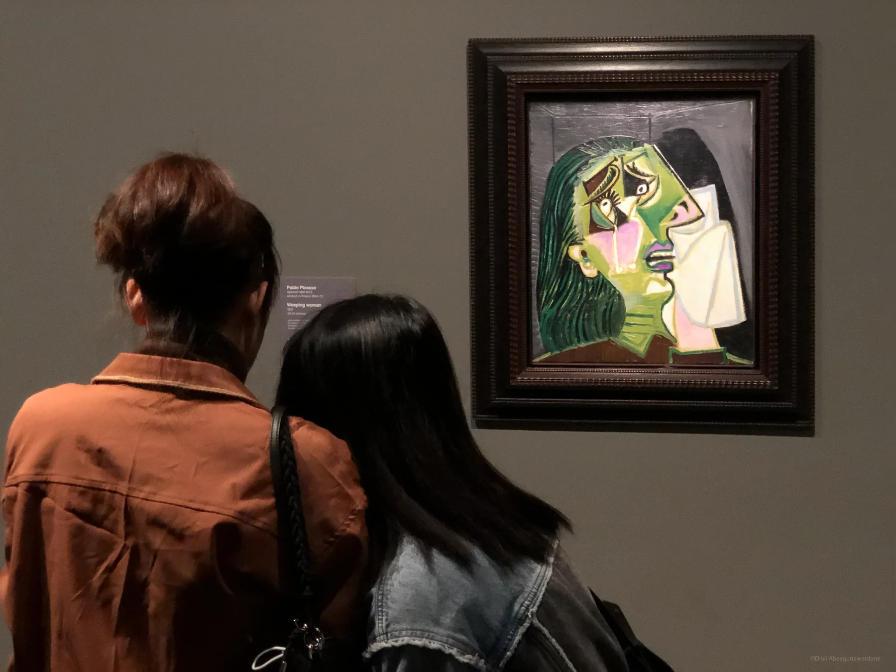 Two girls in front of Weeping Woman by Pablo Picasso - Picasso Century - National Gallery of Victoria (NGV), Melbourne, Australia - image from Struck by Light, by Dinil Abeygunawardane